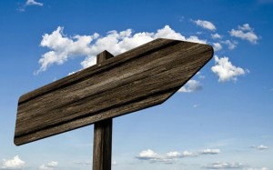 Signpost with a blank wooden signboard