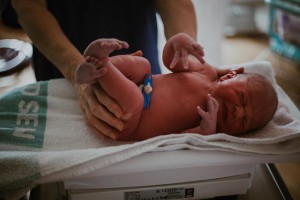 Newborn baby being weighed
